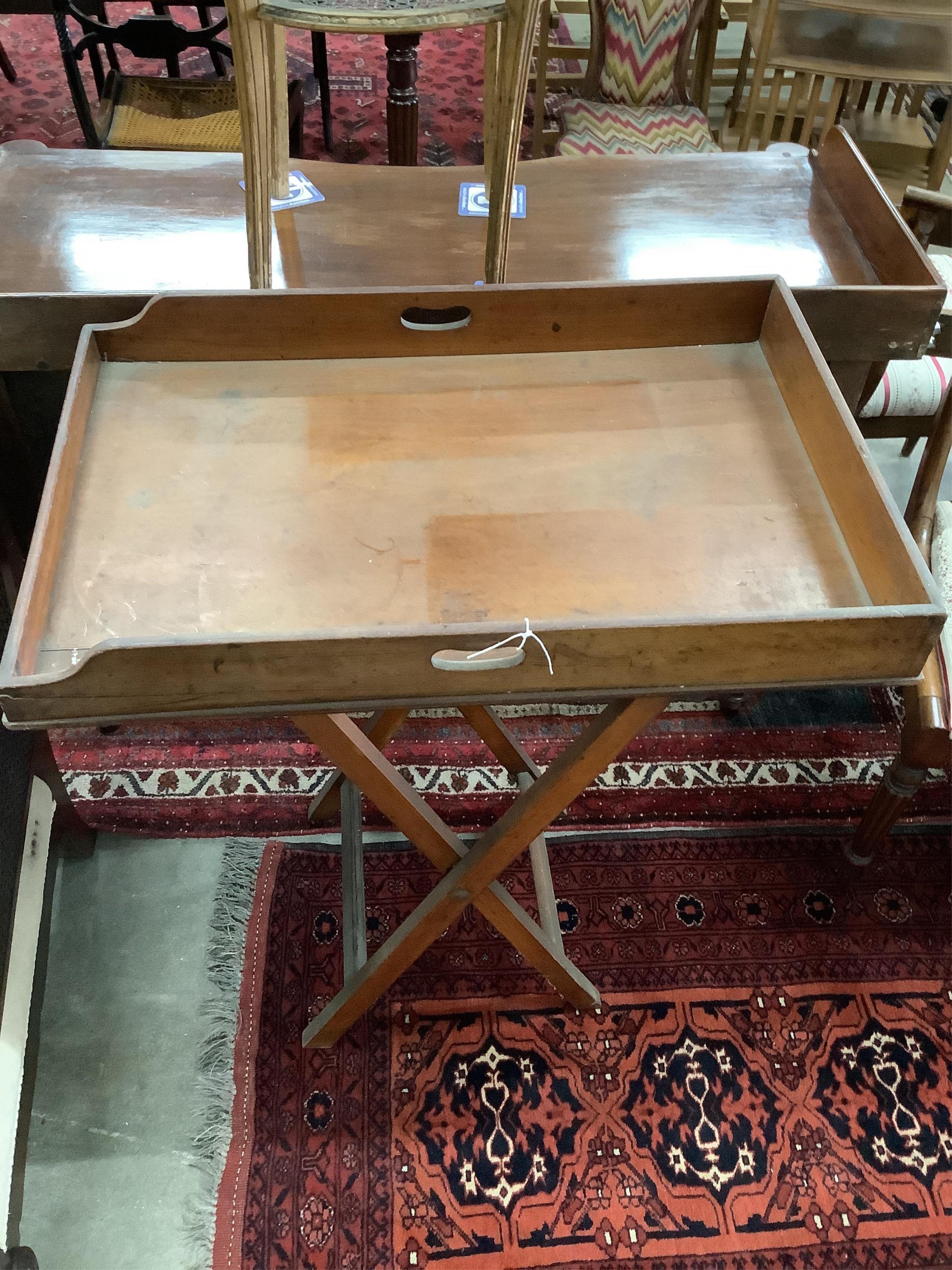 A Victorian rectangular mahogany butler's tray on folding stand, width 78cm, depth 52cm, height 90cm. Condition - fair